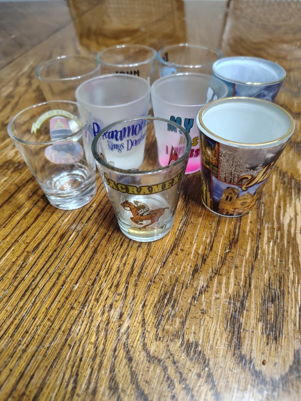 Collection of 9 Assorted Shot glasses (can sell separately if interested)